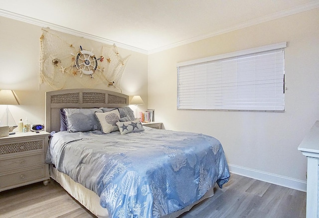 bedroom featuring crown molding and wood-type flooring