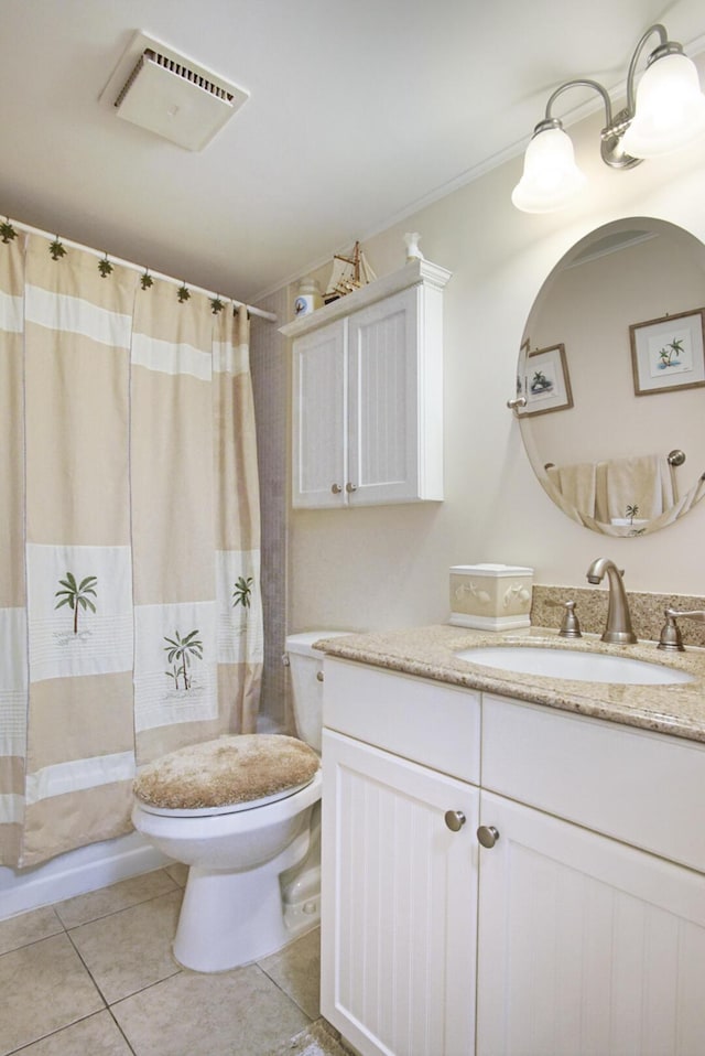 bathroom featuring a shower with shower curtain, vanity, toilet, and tile patterned flooring