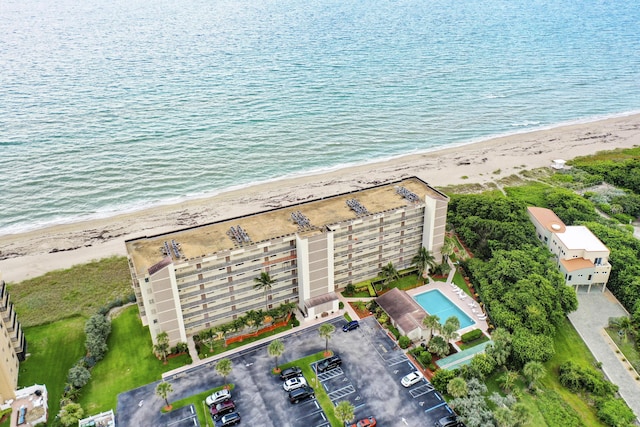 aerial view featuring a view of the beach and a water view