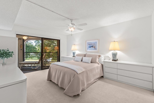 carpeted bedroom featuring ceiling fan, a textured ceiling, and access to outside