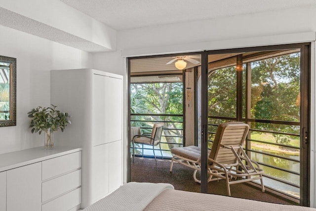 bedroom with multiple windows and a textured ceiling