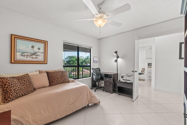 bedroom featuring access to exterior, light tile patterned floors, a textured ceiling, and ceiling fan