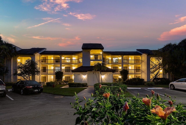 view of outdoor building at dusk