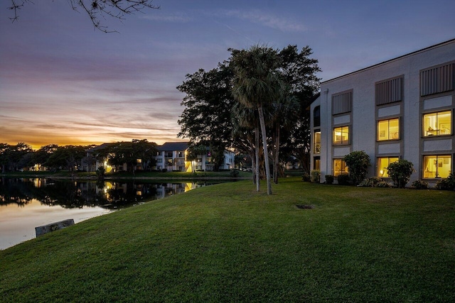 yard at dusk with a water view