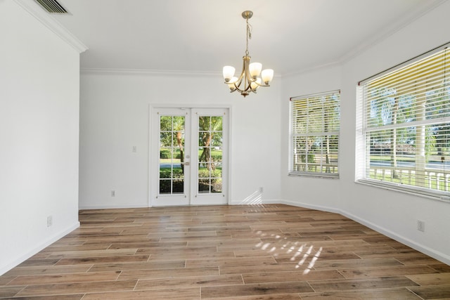 interior space featuring ornamental molding, hardwood / wood-style floors, and a wealth of natural light