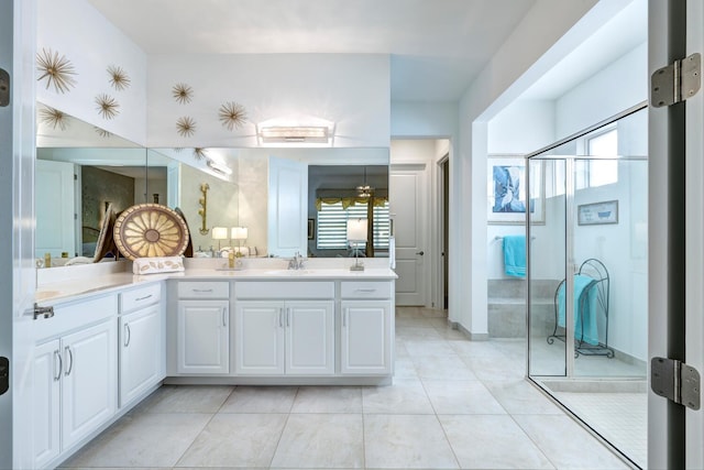 bathroom featuring vanity, an enclosed shower, and tile patterned floors