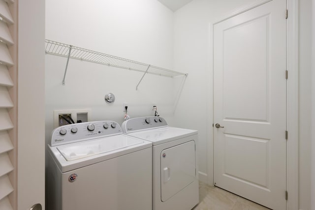 laundry area with washer and clothes dryer