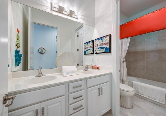 full bathroom with vanity, tile patterned flooring, toilet, and shower / bath combo with shower curtain