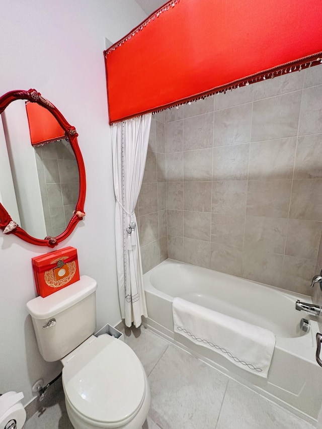 bathroom with toilet, tile patterned flooring, and shower / tub combo