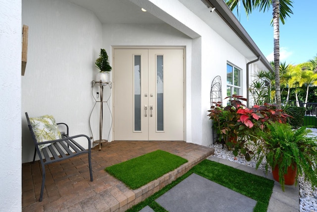 doorway to property with a patio area