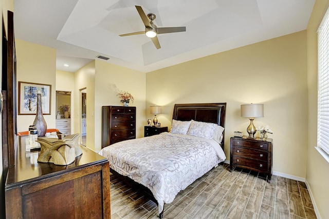 bedroom featuring a tray ceiling and ceiling fan