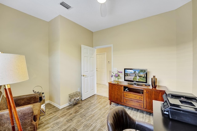 office space featuring ceiling fan and light hardwood / wood-style floors