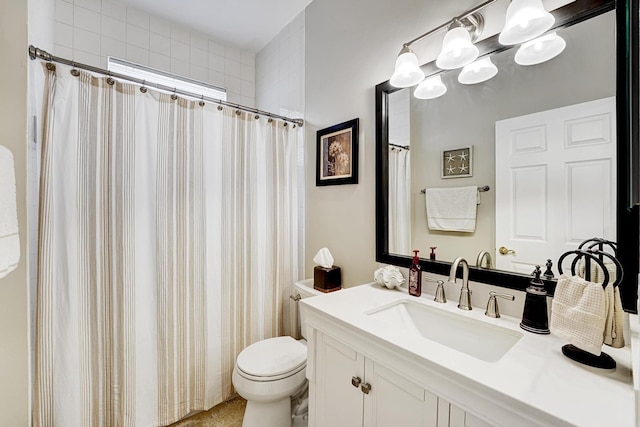 bathroom featuring a shower with curtain, vanity, and toilet