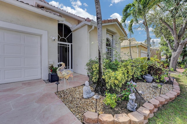 property entrance featuring a garage