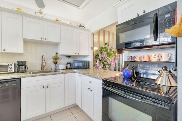 kitchen featuring white cabinets, sink, and black appliances