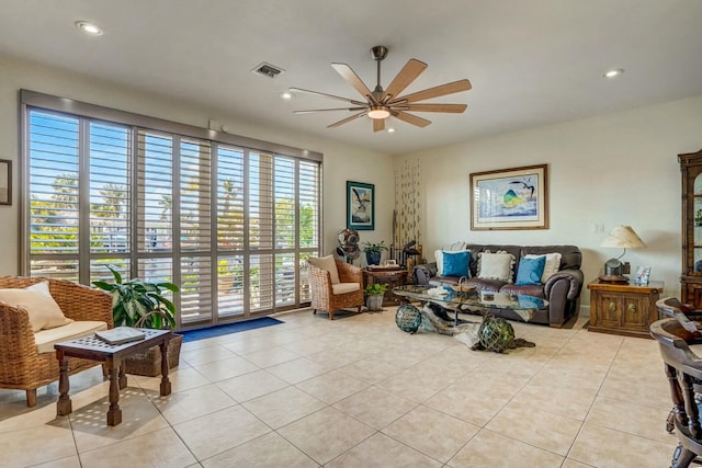 living room with ceiling fan and light tile patterned floors