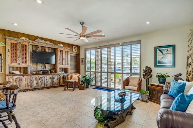 living room with light tile patterned floors and ceiling fan