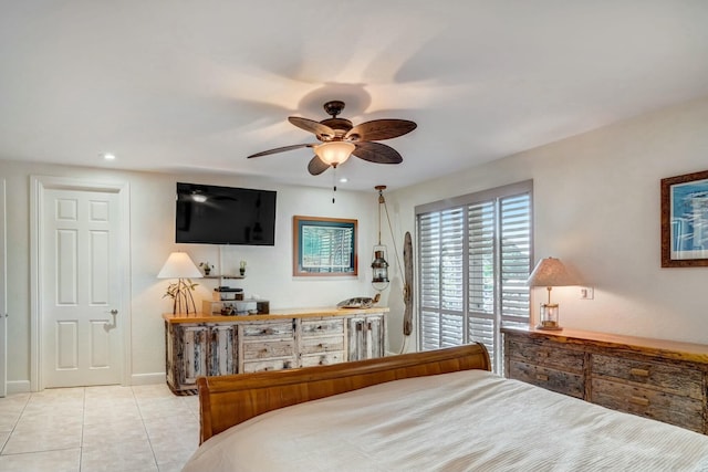 bedroom with ceiling fan and light tile patterned floors