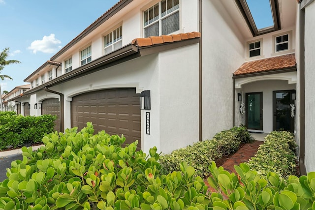 view of property exterior featuring a garage