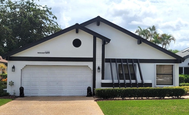 ranch-style home featuring a garage and a front yard