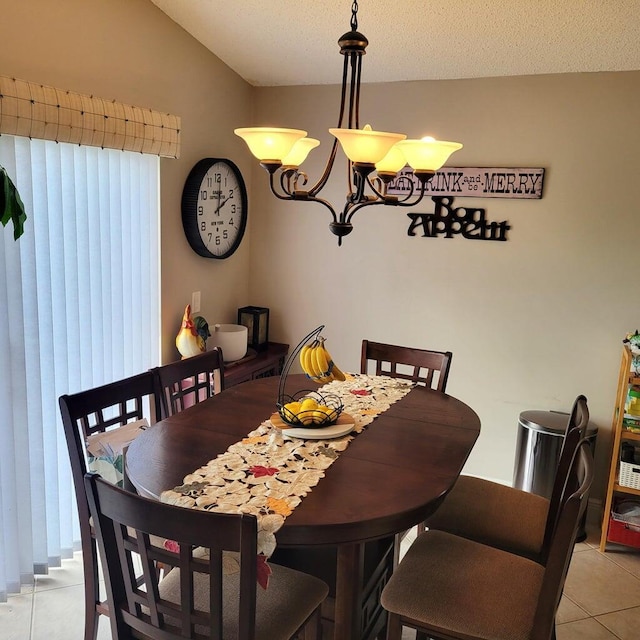 tiled dining area with a textured ceiling