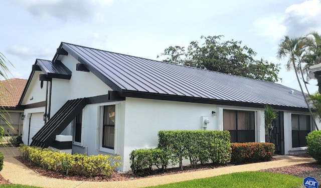 view of home's exterior with a garage