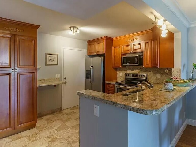 kitchen with appliances with stainless steel finishes, a breakfast bar, sink, backsplash, and kitchen peninsula