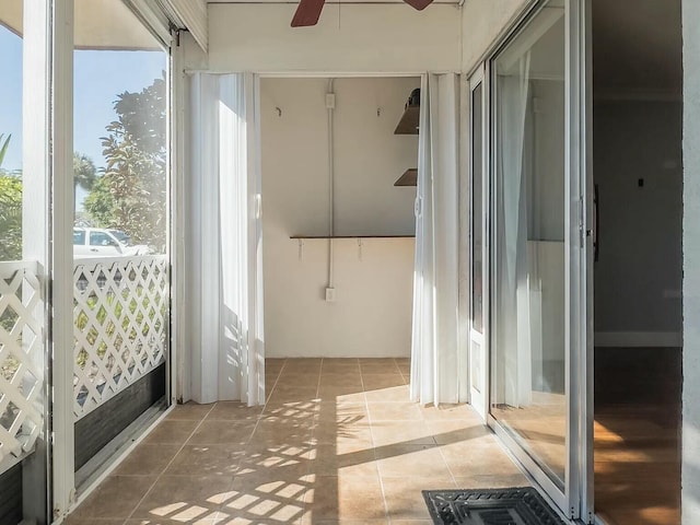 interior space featuring ceiling fan