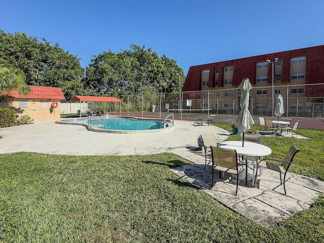 view of pool featuring a yard and a patio area