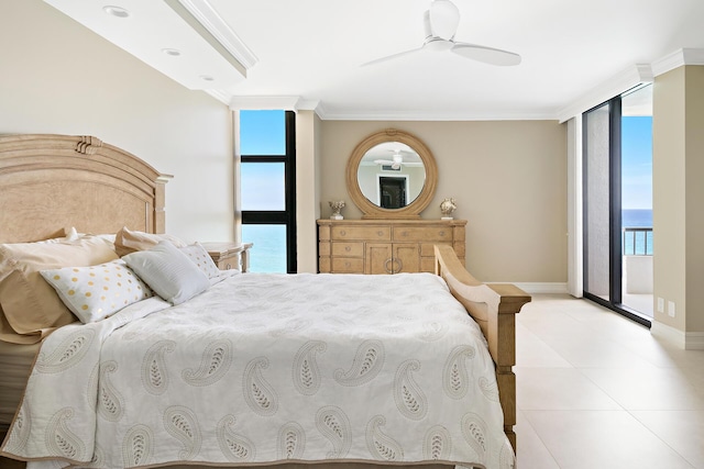 bedroom with crown molding, access to outside, a wall of windows, and a water view