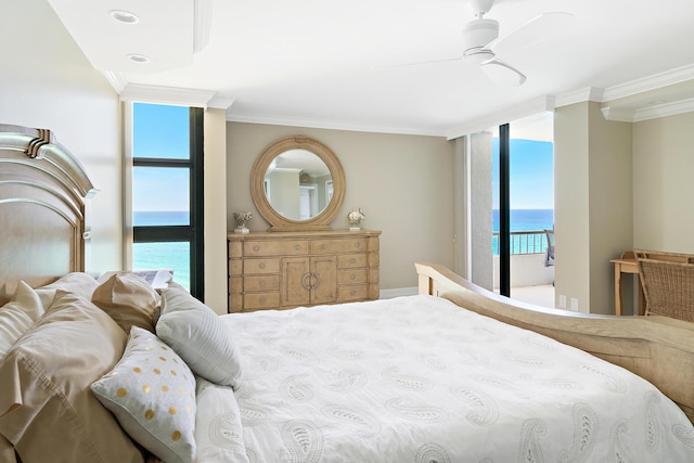 bedroom with ornamental molding, a water view, and ceiling fan