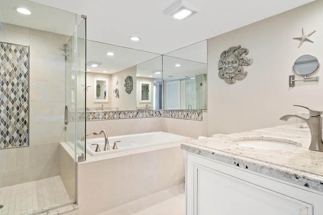 bathroom with vanity, shower with separate bathtub, and tile patterned floors