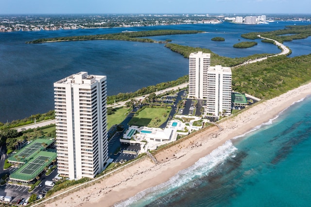 birds eye view of property with a water view and a view of the beach