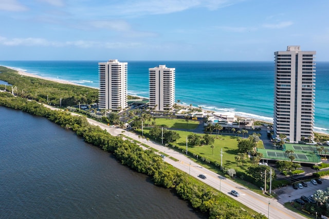 drone / aerial view with a water view and a view of the beach