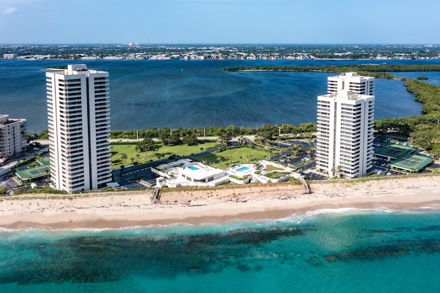 aerial view with a water view and a beach view