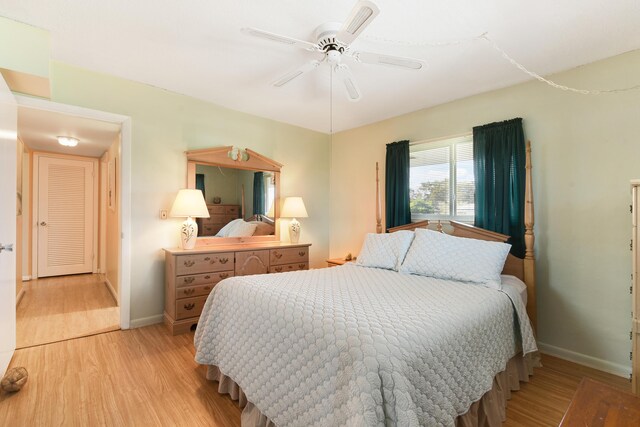 bedroom featuring ceiling fan and light hardwood / wood-style flooring