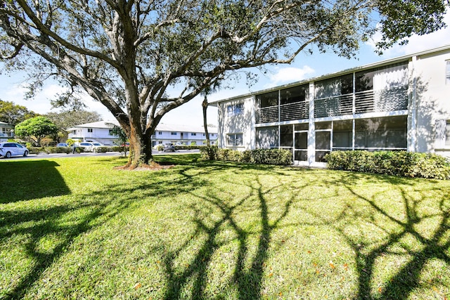 view of yard featuring a sunroom