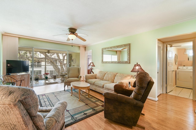 living room featuring washer / clothes dryer, crown molding, ceiling fan, and light hardwood / wood-style flooring