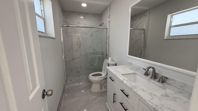 bathroom featuring walk in shower, vanity, and toilet