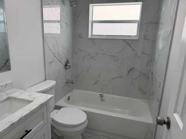 full bathroom with tiled shower / bath combo, vanity, and toilet