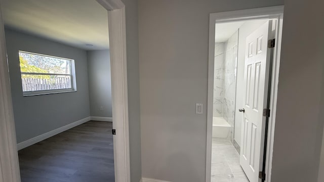 corridor featuring light hardwood / wood-style floors