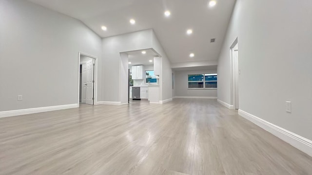 unfurnished living room with light wood-type flooring