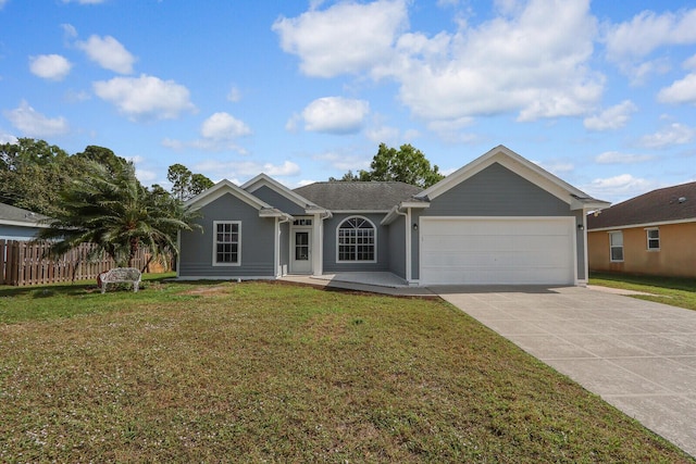 ranch-style house featuring a garage and a front lawn