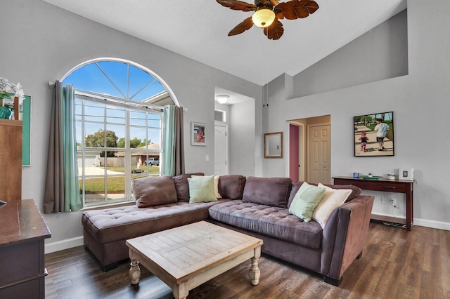 living room featuring ceiling fan, dark hardwood / wood-style flooring, and high vaulted ceiling