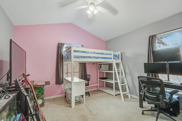 bedroom featuring ceiling fan, vaulted ceiling, light colored carpet, and a textured ceiling