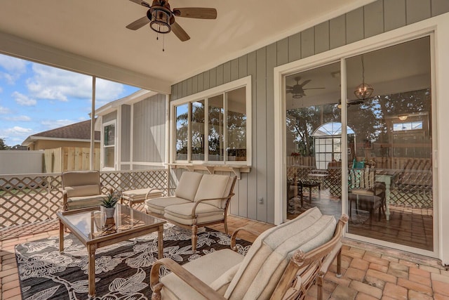 sunroom / solarium with ceiling fan