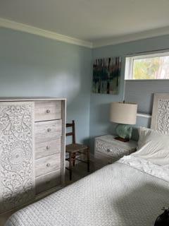 bedroom featuring ornamental molding