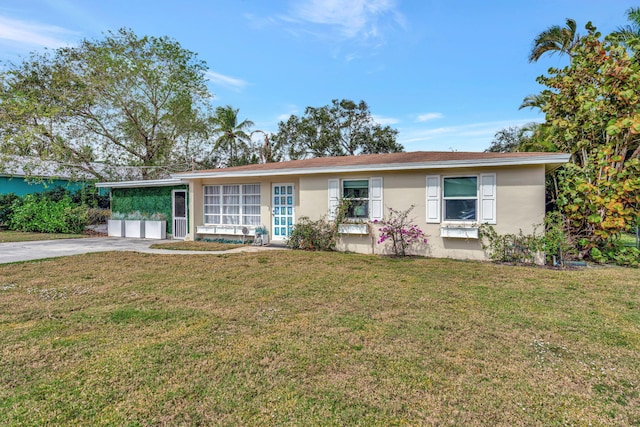 ranch-style house with a front lawn