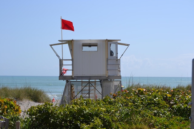 surrounding community with a water view