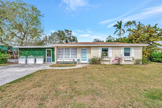 single story home with stucco siding, concrete driveway, and a front lawn
